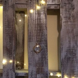 “Love is” magnifying pendant necklace